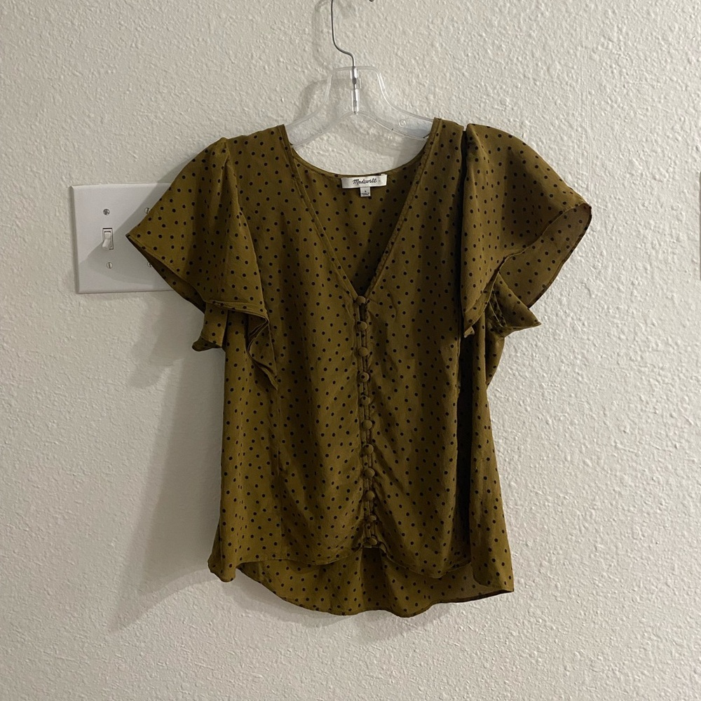 Green and black polka dot blouse